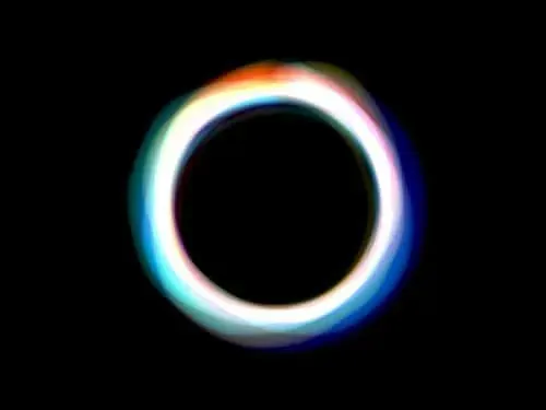 A luminous white ring on black, its edge fringed into red, green and blue
